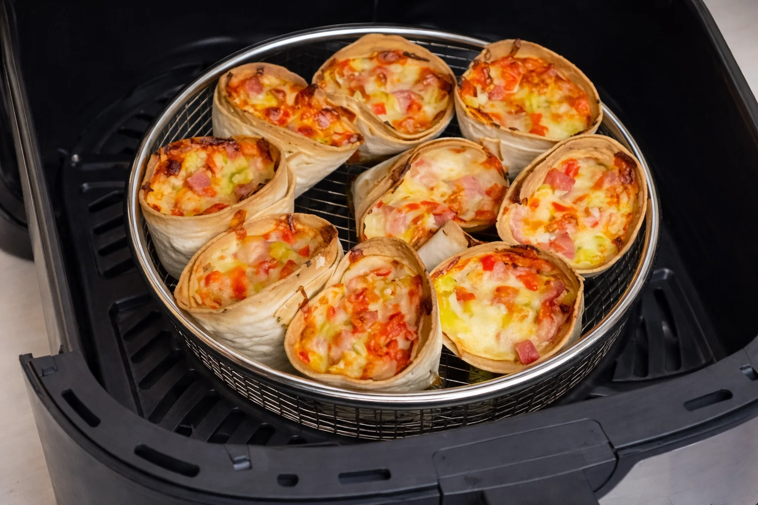 Crispy air fryer pizza cones with melted cheese and golden edges
