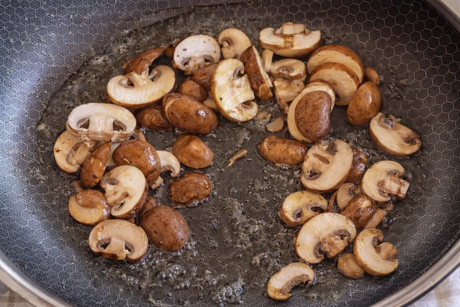 Garlic and thyme infusing steak as it finishes cooking in butter