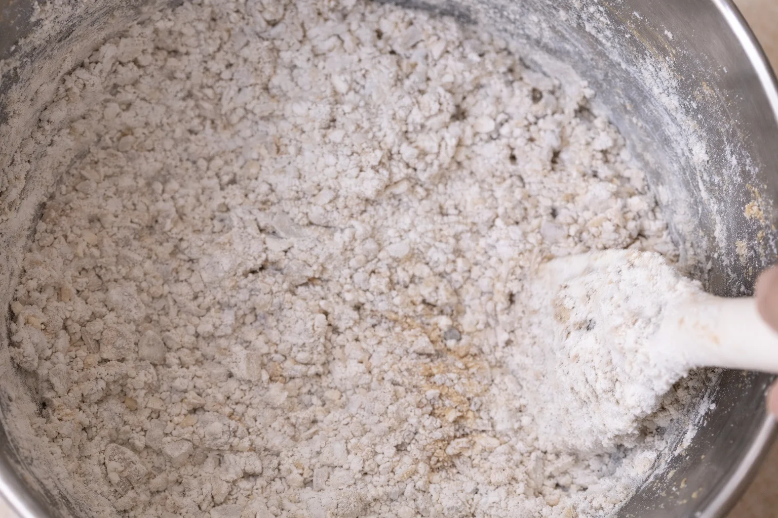 Flour mixture added to cookie dough and mixed just until combined