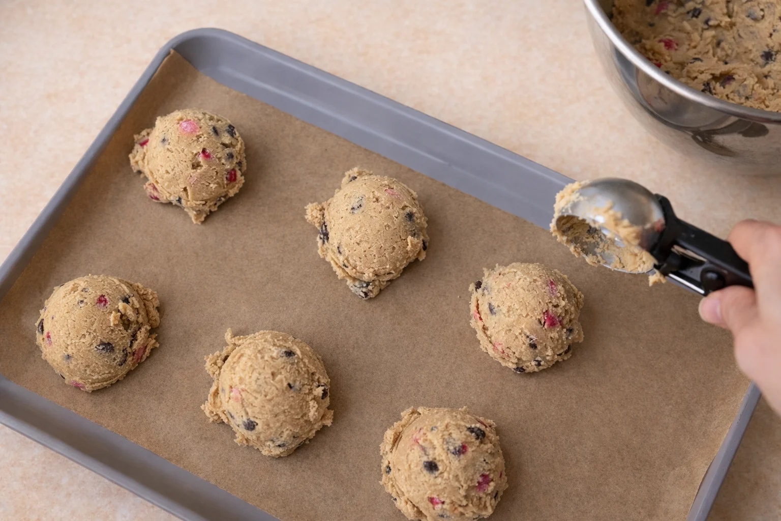 Cookie dough scooped onto baking tray before chilling or baking