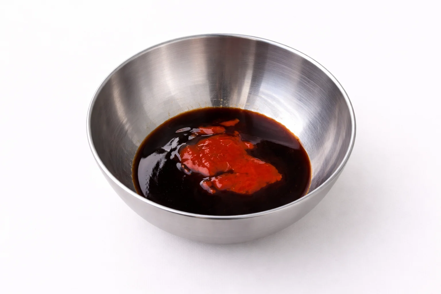 Soy sauce and sriracha mixture for honey garlic chicken wing sauce