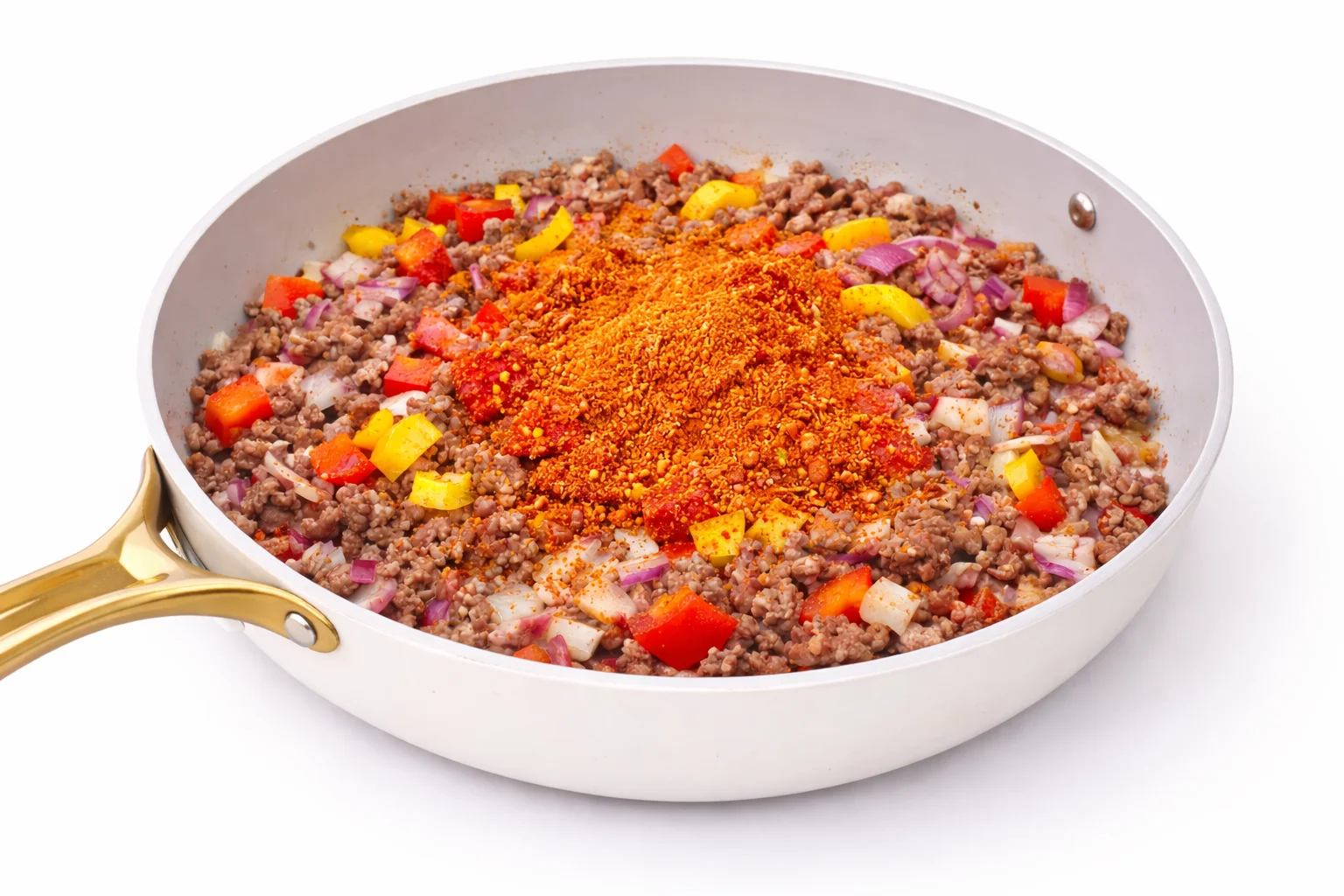 adding seasoning to ground beef mixture