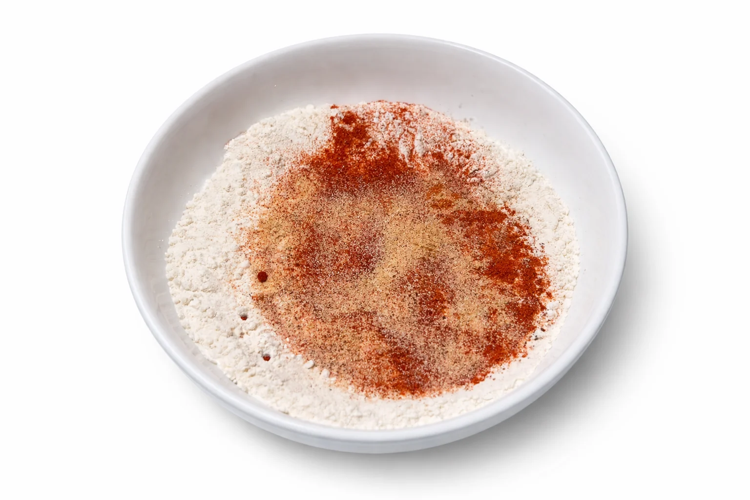 Seasoned flour mixture prepared for coating chicken