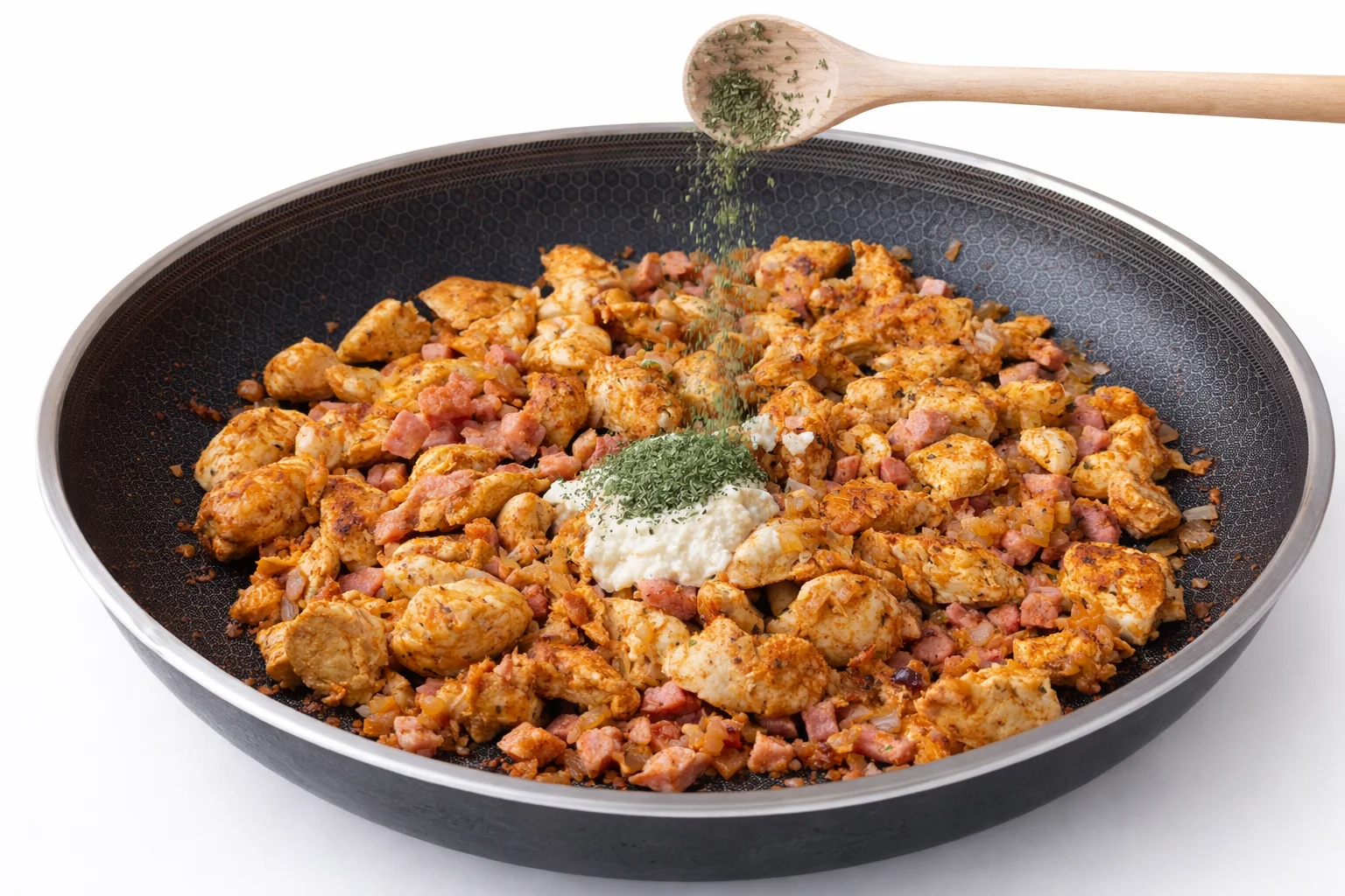 Cream cheese and dried herbs added to chicken and bacon mixture in skillet for creamy rice recipe