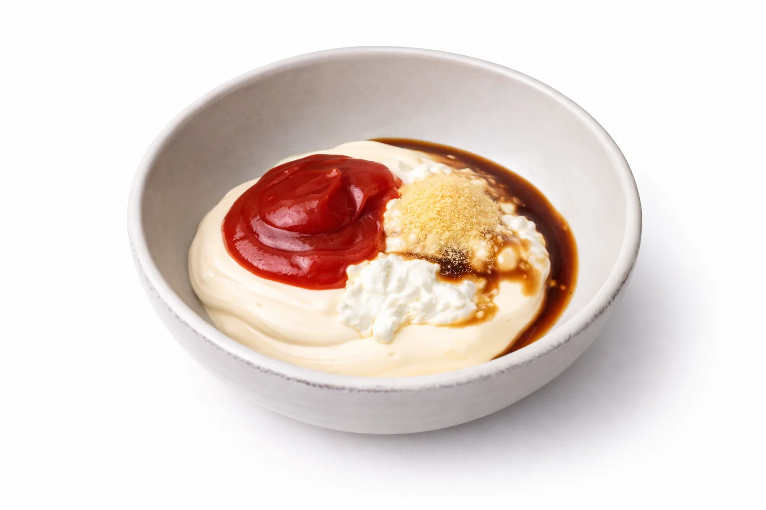 Garlic powder and paprika added to the Cane’s sauce ingredients in a mixing bowl.