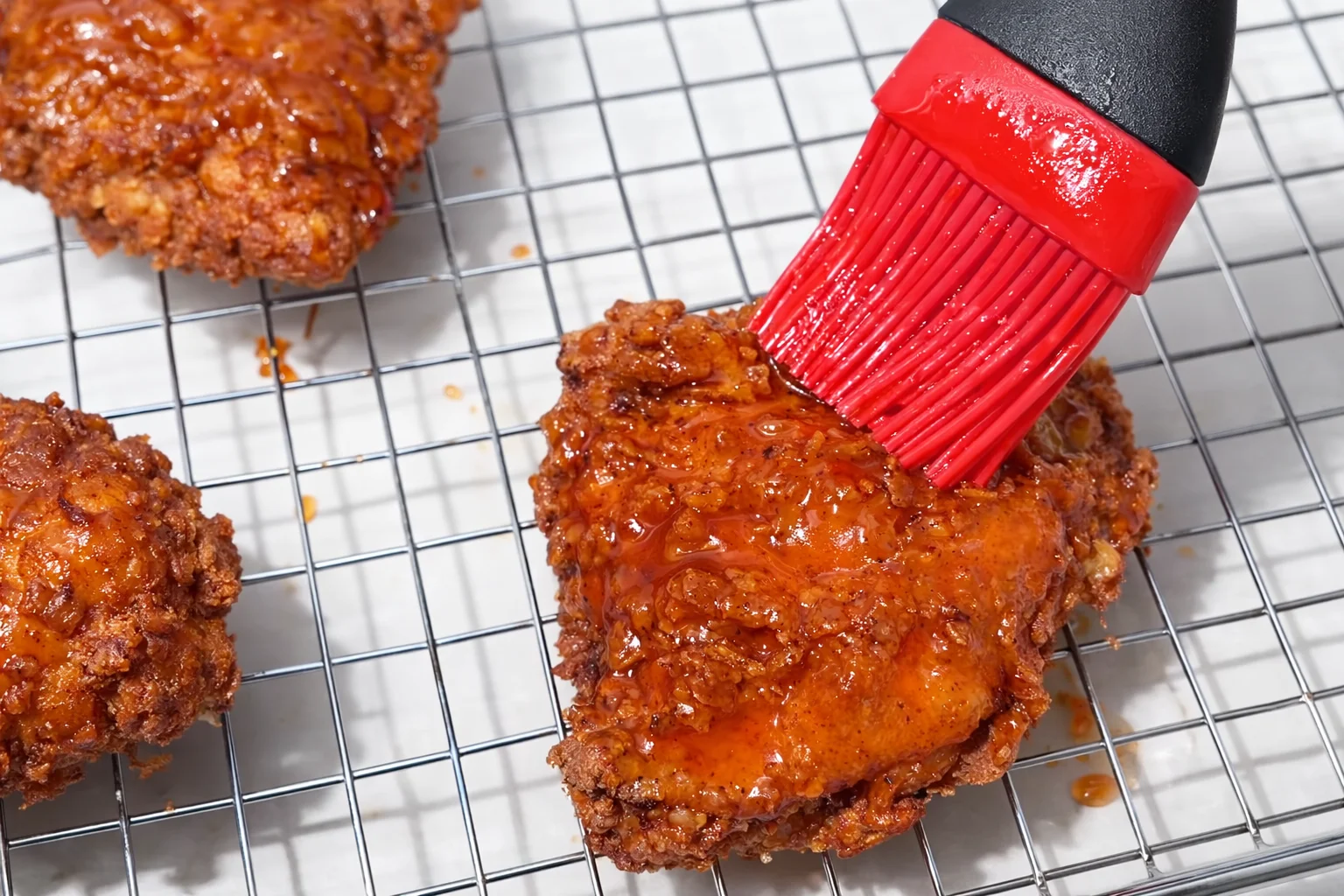 Hot honey glaze brushed over crispy fried chicken