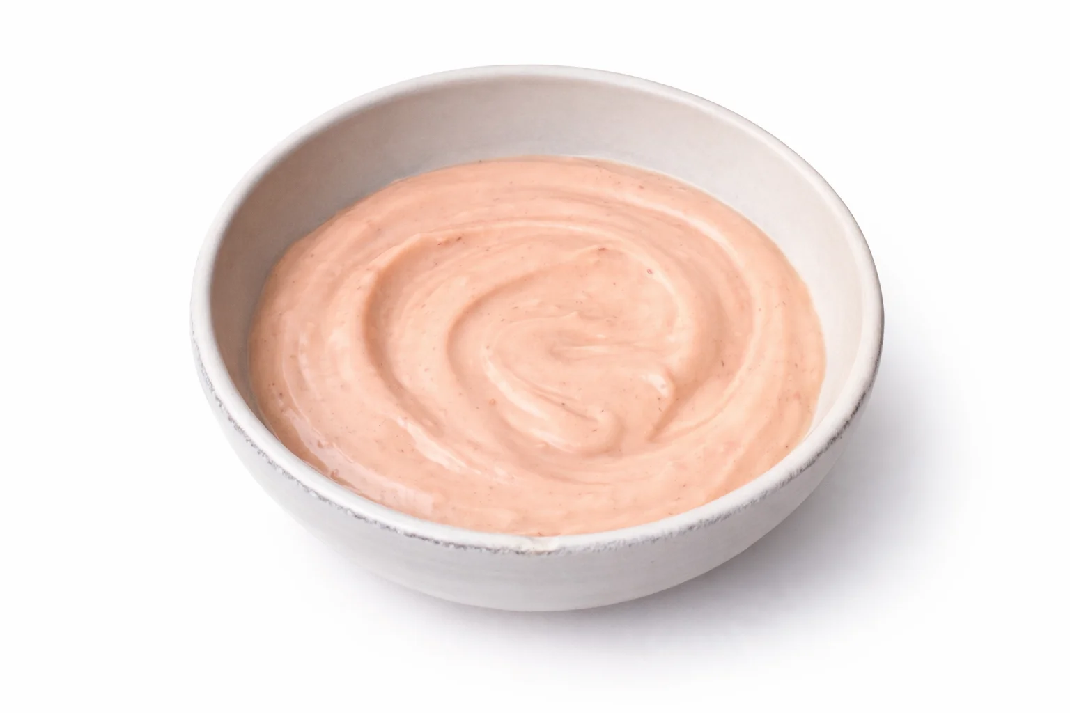 Creamy homemade low calorie Cane’s sauce fully mixed in a bowl with a smooth light orange texture.