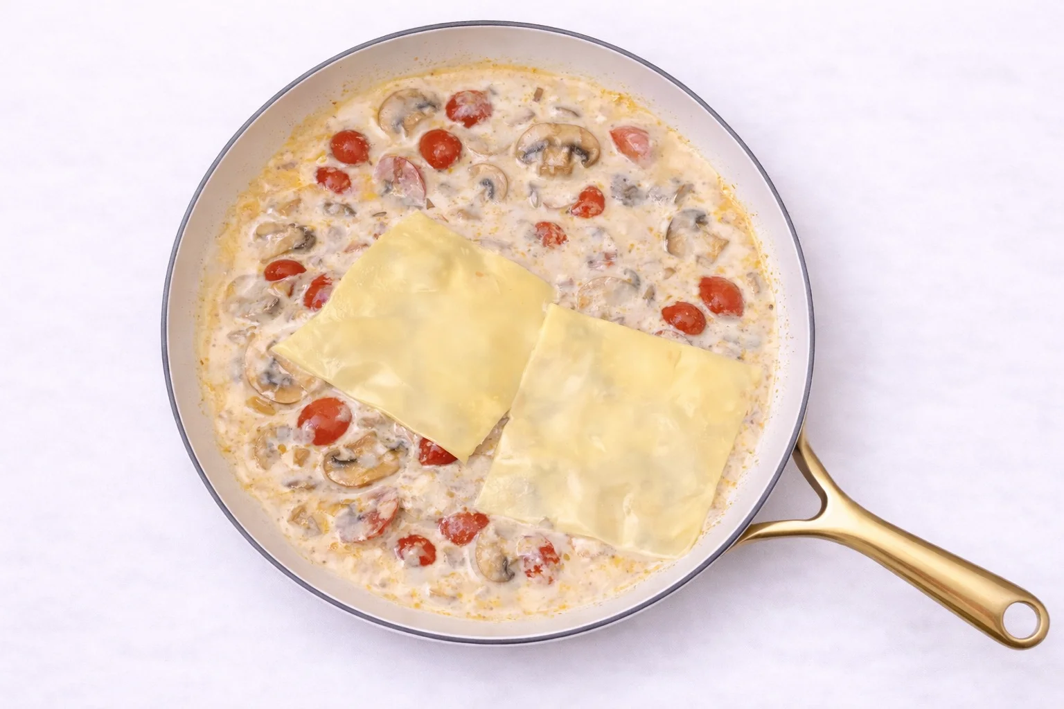 creamy tuscan sauce with mushrooms tomatoes and melting cheese