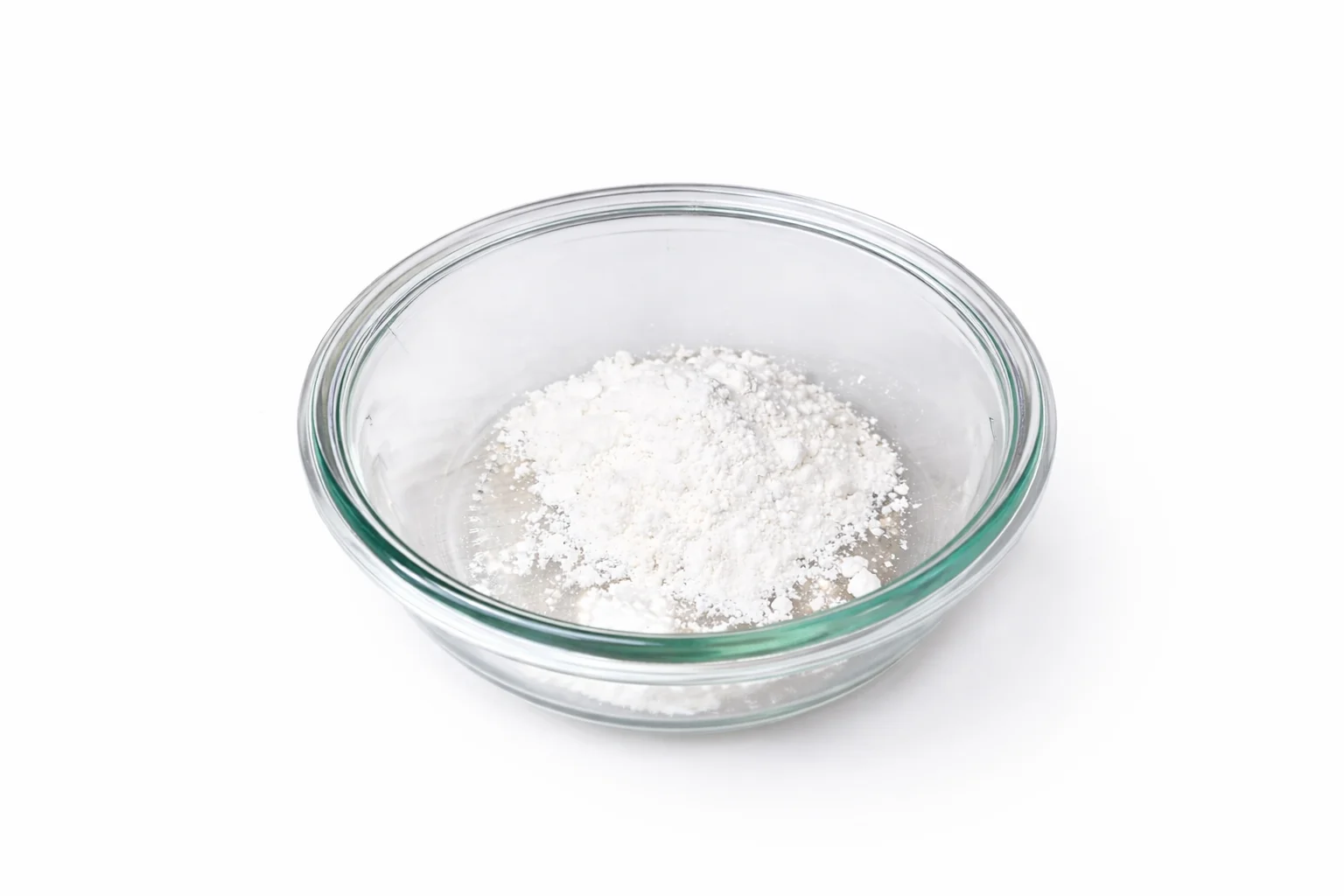 All purpose flour in a glass bowl prepared for coating air fryer mozzarella sticks