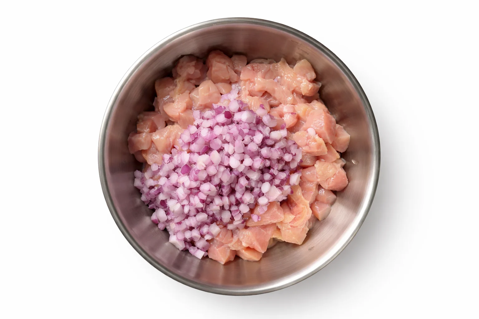 diced chicken mixed with onion garlic and spices for tortilla cone filling