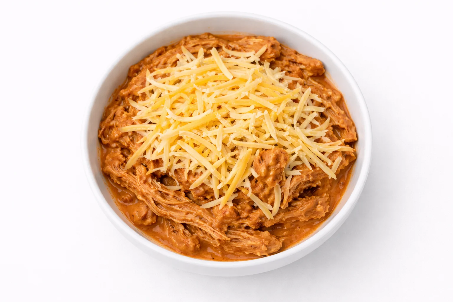 buffalo chicken mixture topped with shredded cheese before baking
