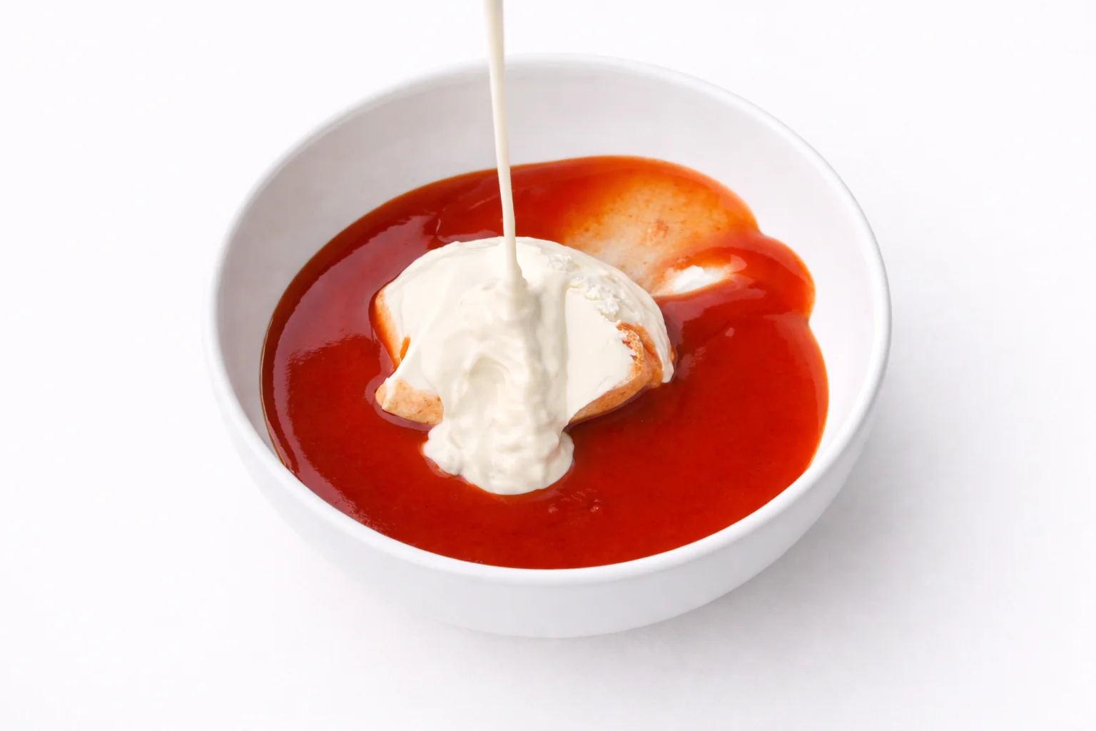buffalo sauce mixed with cream cheese and ranch dressing in a bowl