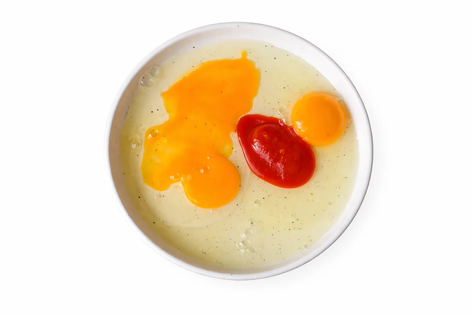 eggs mixed with sriracha for coating chicken