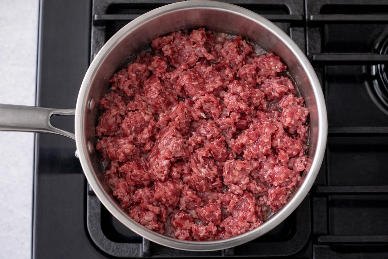 ground beef cooking in pan for casserole recipe
