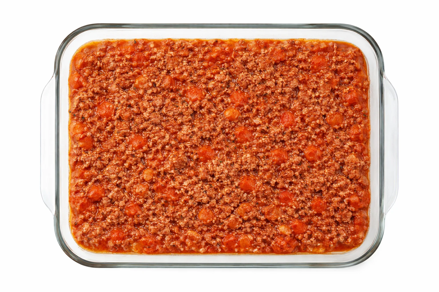 ground beef sauce layered over sliced potatoes in casserole dish