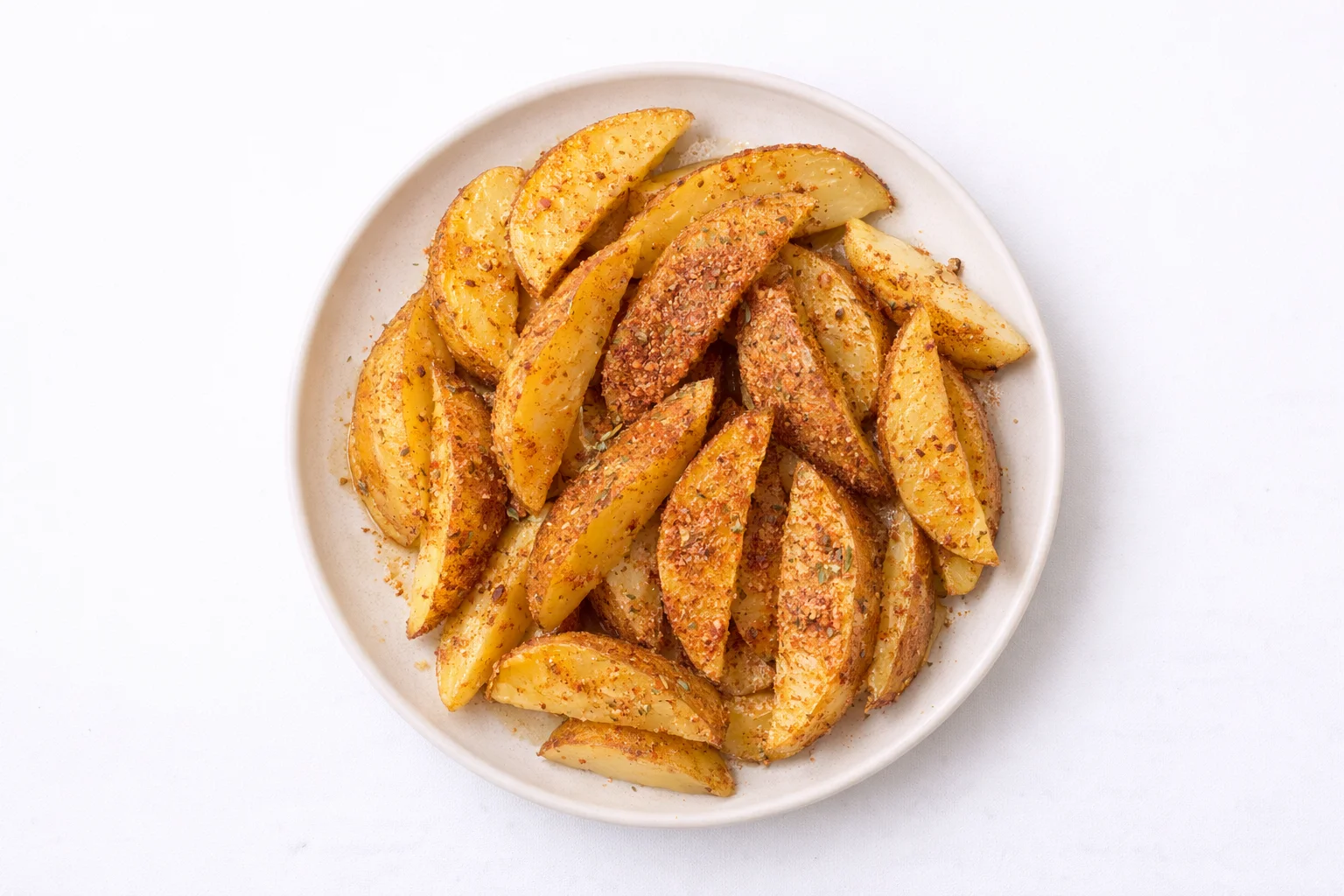 potato wedges coated with garlic parmesan seasoning